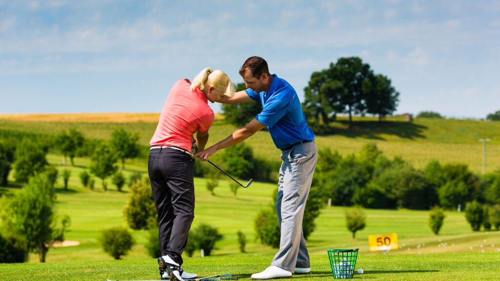 Golfer receiving instruction