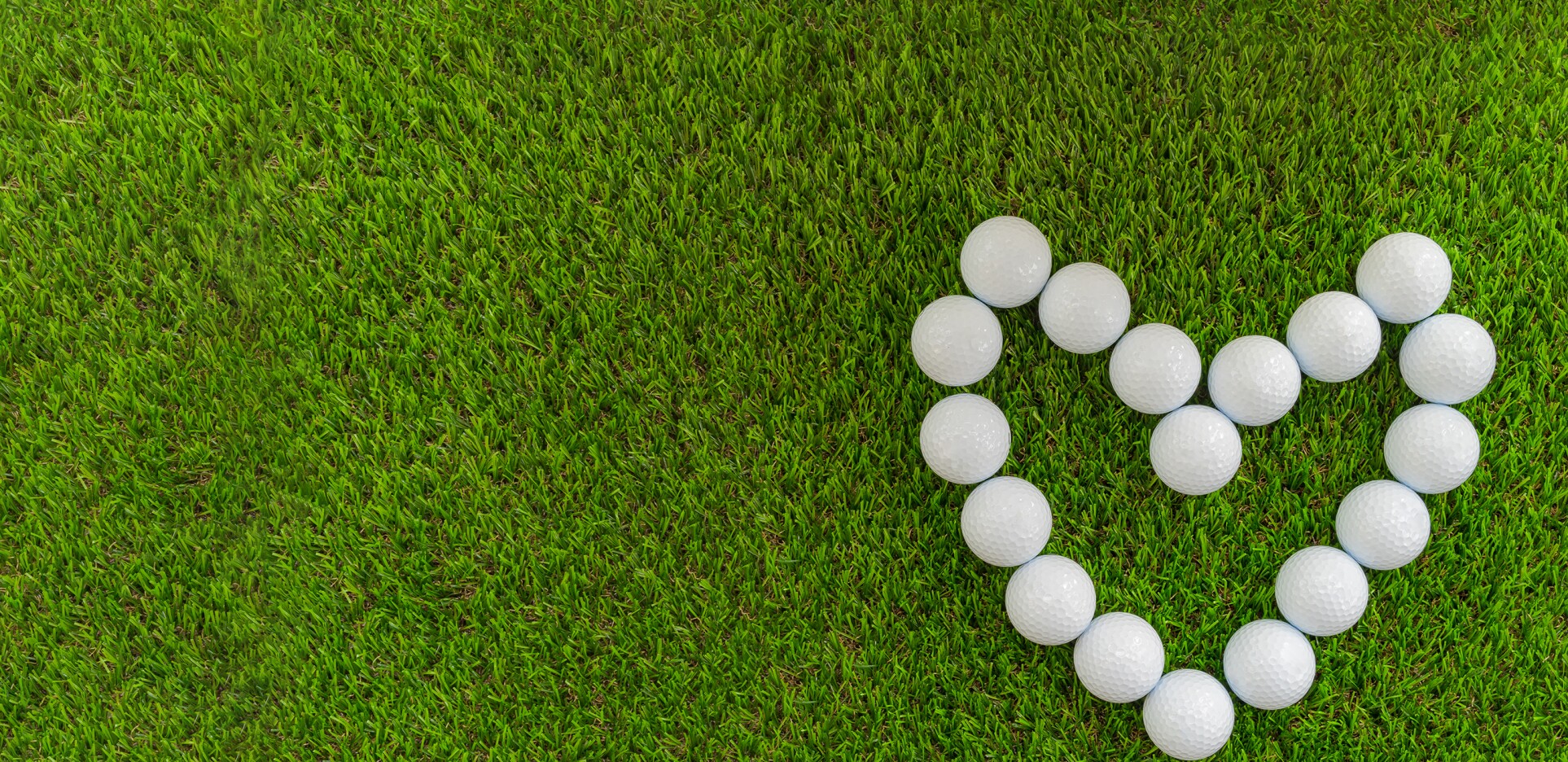 Golf balls arranged in the shape of a heart